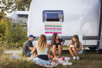 Family relaxing at camping site