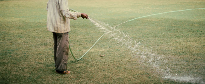 Full length of man standing on field