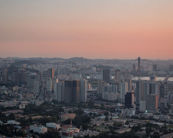 High angle view of buildings against sky during sunset