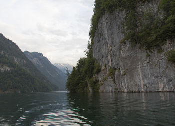 Scenic view of mountains and river against sky