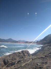 Scenic view of sea against clear sky