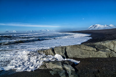 Scenic view of lake against sky during winter