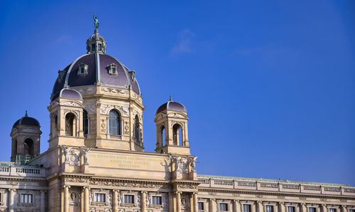 Low angle view of building against blue sky