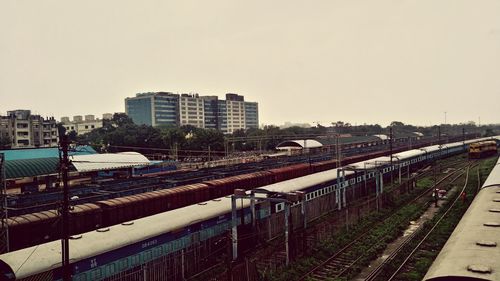 High angle view of train in city against clear sky