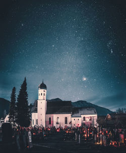 Illuminated building against sky at night