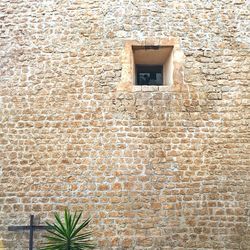 Low angle view of brick wall