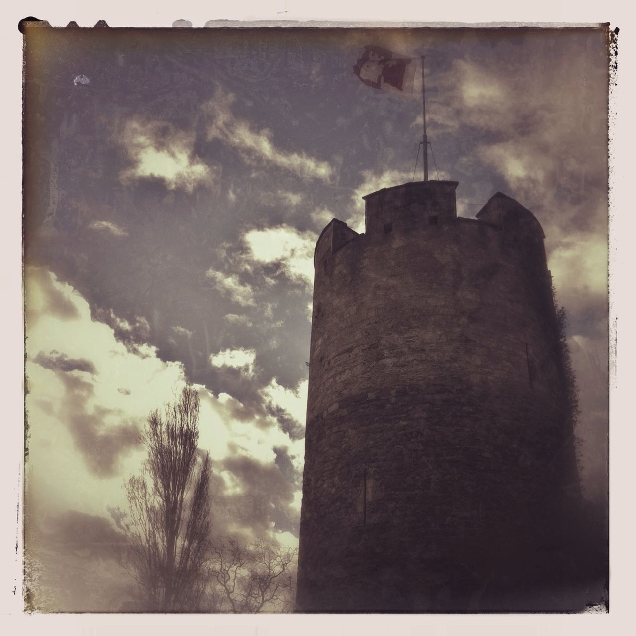 transfer print, auto post production filter, sky, low angle view, cloud - sky, built structure, architecture, building exterior, cloudy, silhouette, cloud, tree, outdoors, tower, nature, dusk, no people, weather, day, tranquility