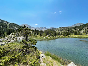 Panoramic view on andorra pyrenees mountains lake landscape