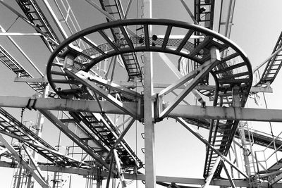 Low angle view of roller coaster against sky