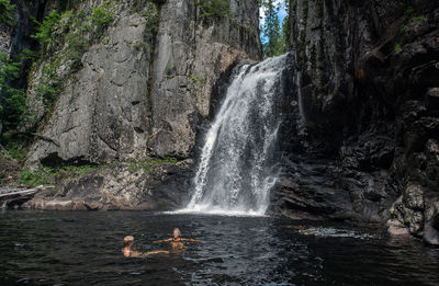 Scenic view of waterfall in forest