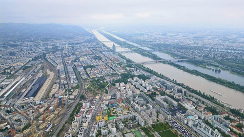 Aerial view of cityscape against sky