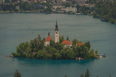 High angle view of buildings by lake