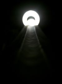 Low angle view of illuminated street light at night