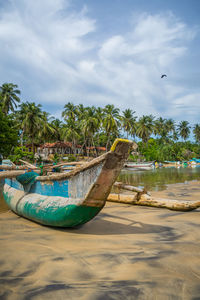 Colorful traditional fishing boat on the beach, arugam bay, sri lanka