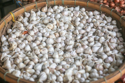 Closeup top view of dried onions are displayed on the dam market, nha trang city, khanh hoa