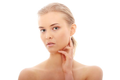 Portrait of a beautiful young woman over white background