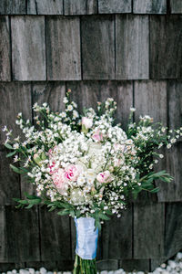 Close-up of flower bouquet against wall