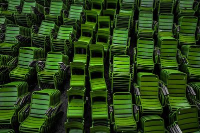 Full frame shot of green empty chairs