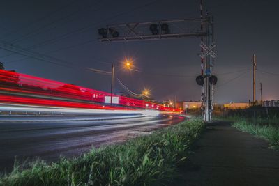 Red light trails on road at night