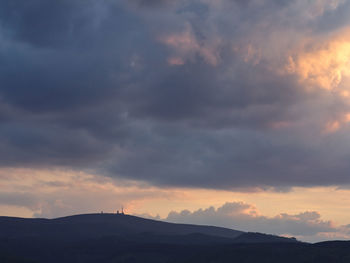 Scenic view of silhouette mountains against sky during sunset