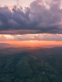 Carpathian mountains. golden hour sunset landscape above and below rushing clouds over the mountains