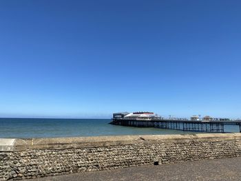 Scenic view of sea against clear blue sky