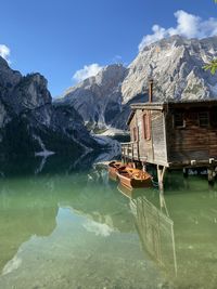 Scenic view of lake and snowcapped mountains against sky