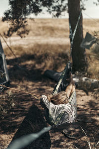 Woman relaxing on hammock