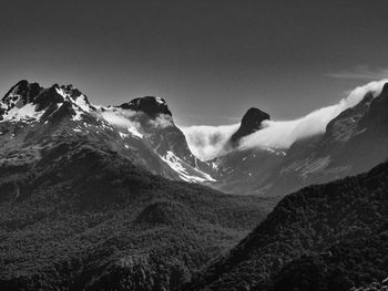 Scenic view of snowcapped mountains against clear sky