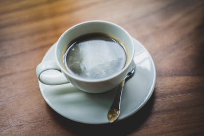 High angle view of coffee cup on table