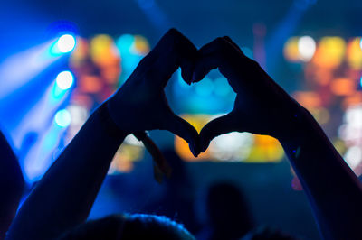 Close-up of hand holding heart shape