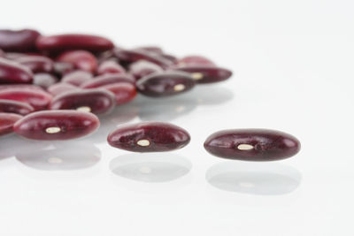 Close-up of fruits over white background