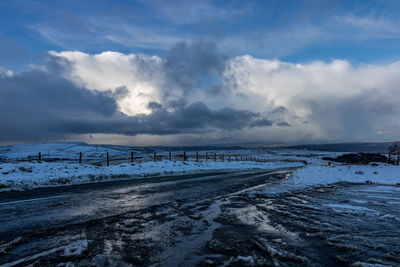 Scenic view of sea against sky during winter