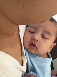 Midsection of woman with baby boy