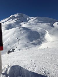 Scenic view of snowcapped mountain against sky