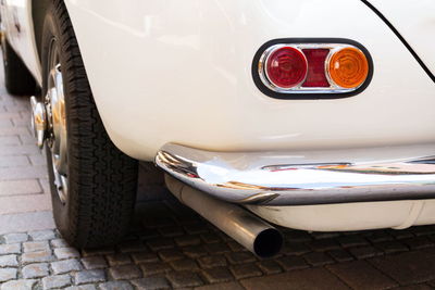 Close-up of vintage car on street