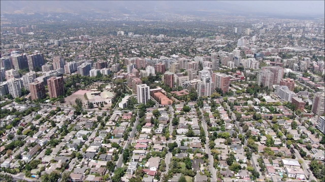 HIGH ANGLE VIEW OF BUILDINGS AGAINST SKY IN CITY