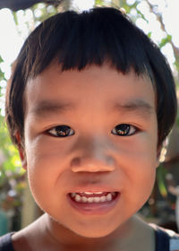 Close-up portrait of smiling boy