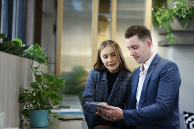 Young couple looking at camera