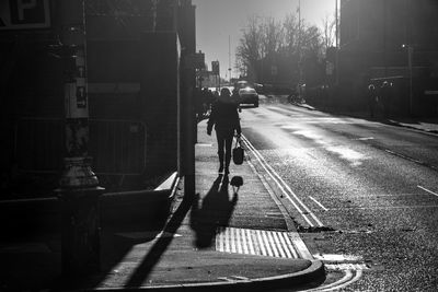 People crossing road in city