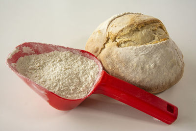 Close-up of cake on table against white background