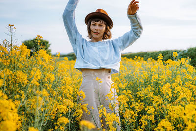 Portrait of man standing on field