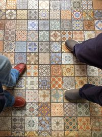 Low section of man standing on floor