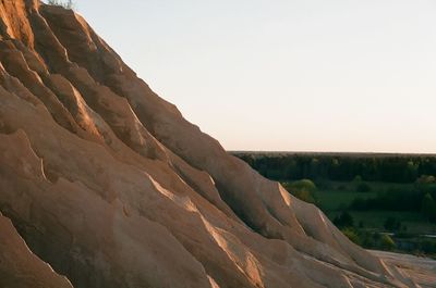 Scenic view of rocky mountains against clear sky