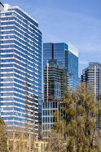 Low angle view of modern buildings against sky