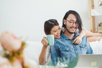 Young couple using mobile phone