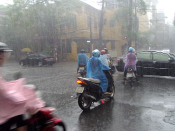 People riding bicycle on city street