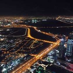 High angle view of illuminated cityscape at night