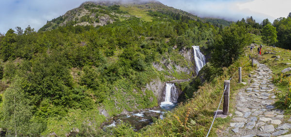 Scenic view of green mountains against sky