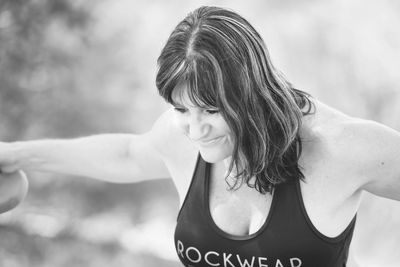 Happy woman exercising in back yard